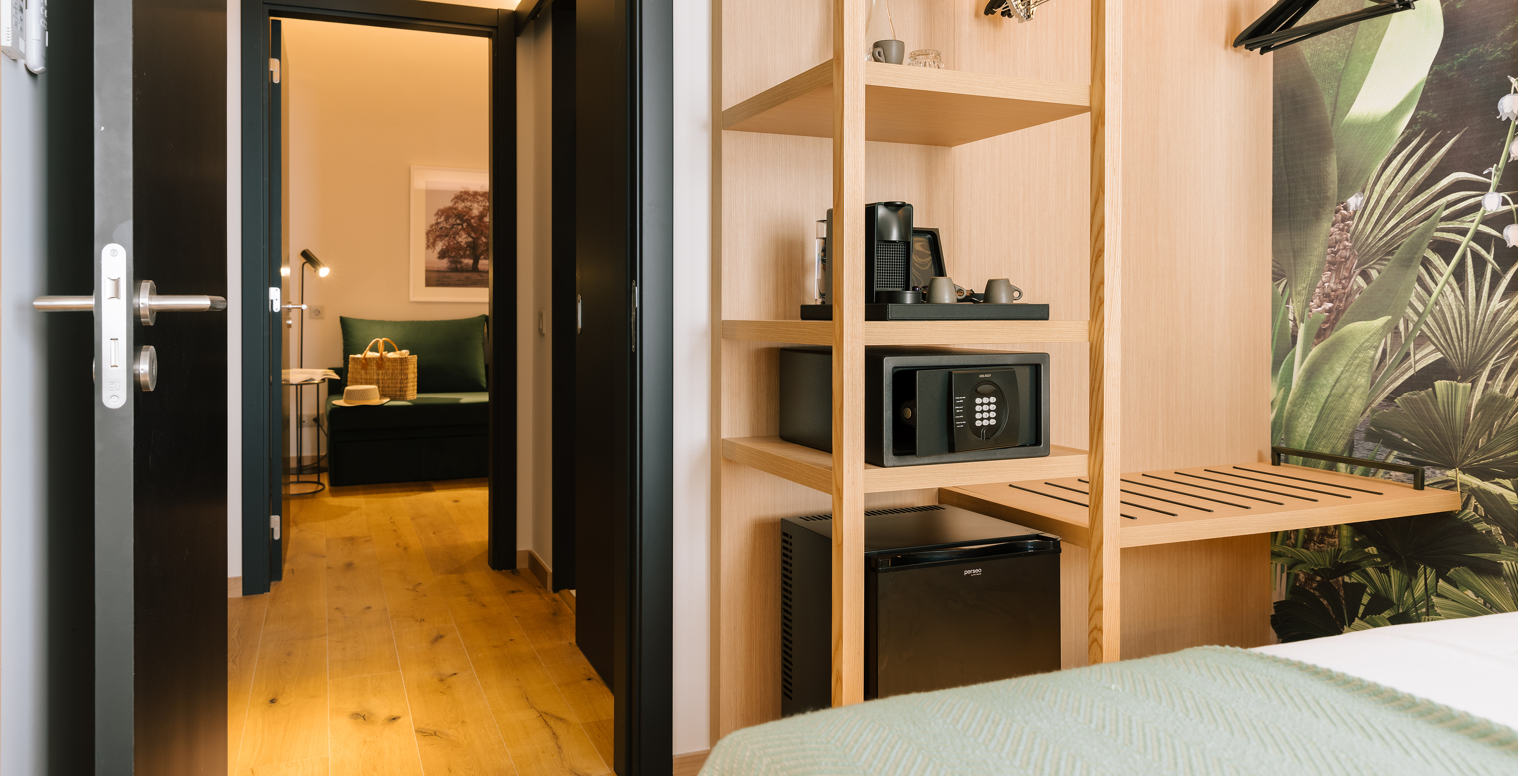 The Family Suite of Pestana Rua Augusta Lisboa has connecting rooms, one of which has a double bed and an open wardrobe