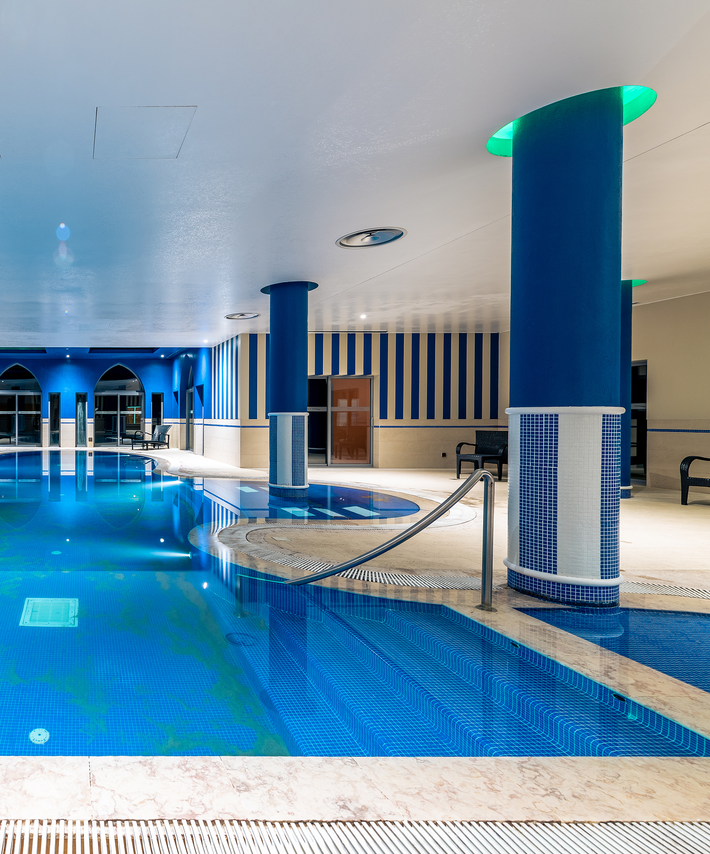 Spa and indoor pool in shades of blue and white with sun loungers at Pestana Sintra Golf Hotel and Spa