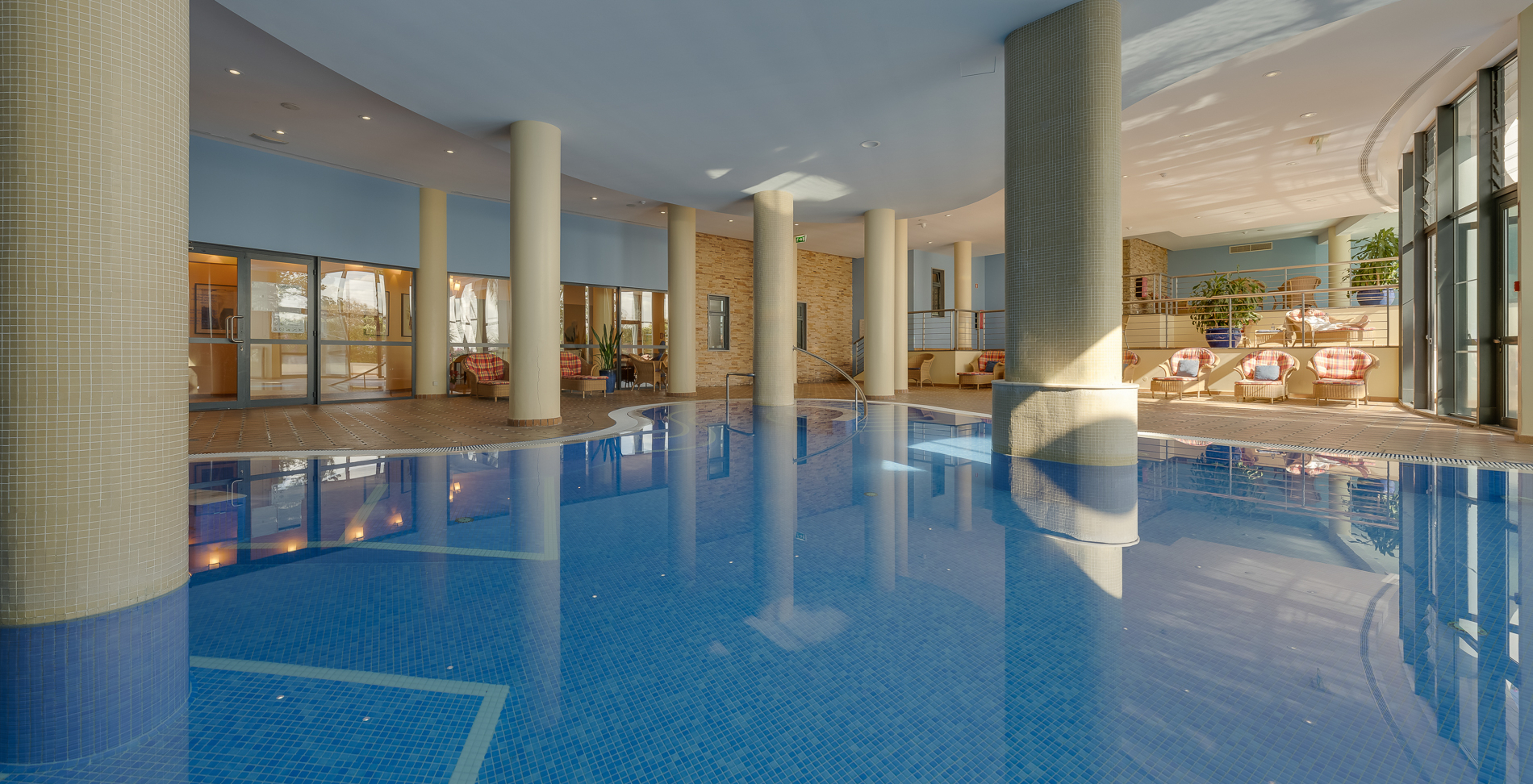 The Pestana Grand, a hotel with spa and pool, facing the sea, has an indoor pool with sun loungers