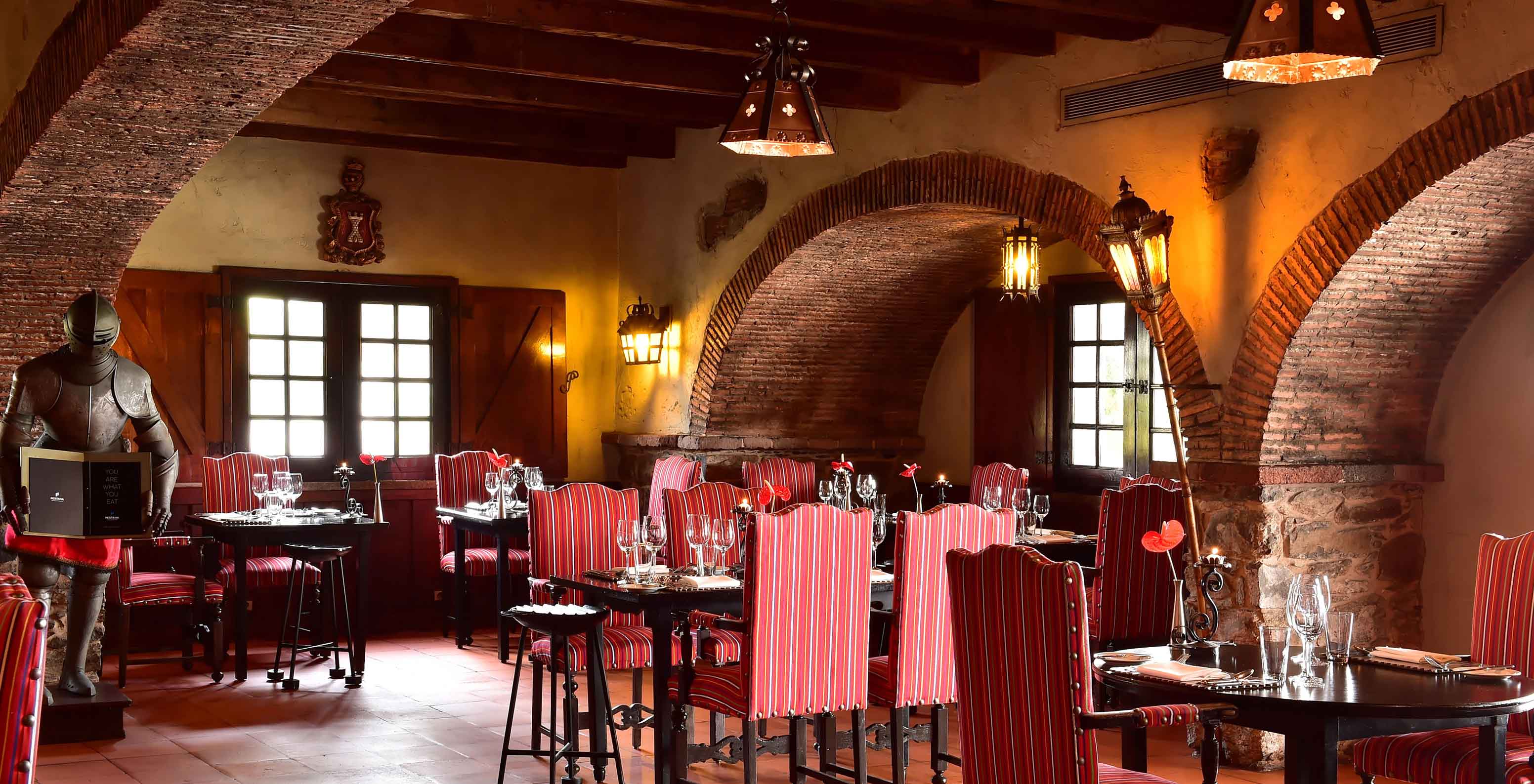 The Taverna Grill restaurant, at the Hotel in the Center of Funchal, Madeira, has red striped chairs