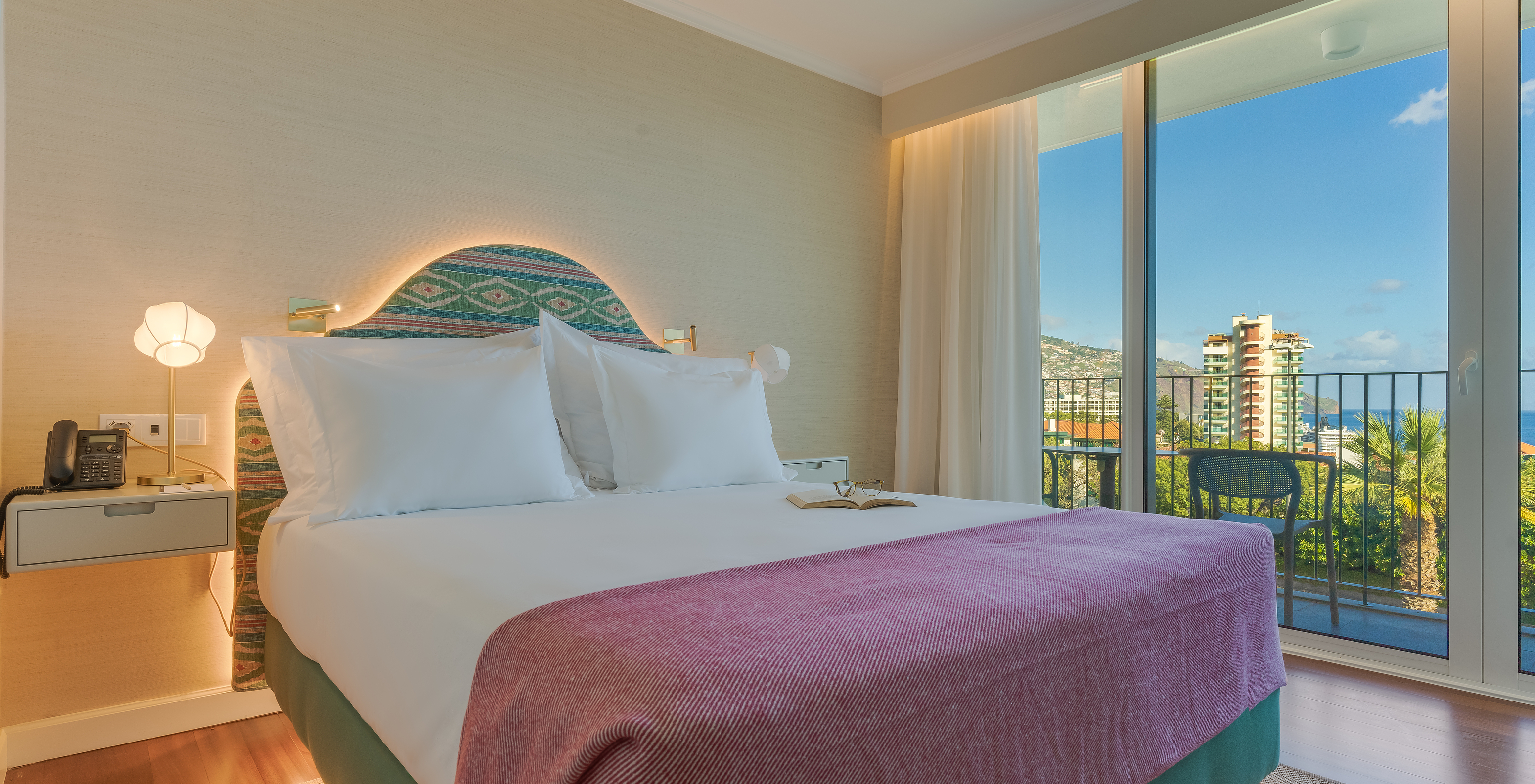 Partial Sea View room with Balcony at Pestana Quinta Perestrello has a double bed, bedside table, and balcony