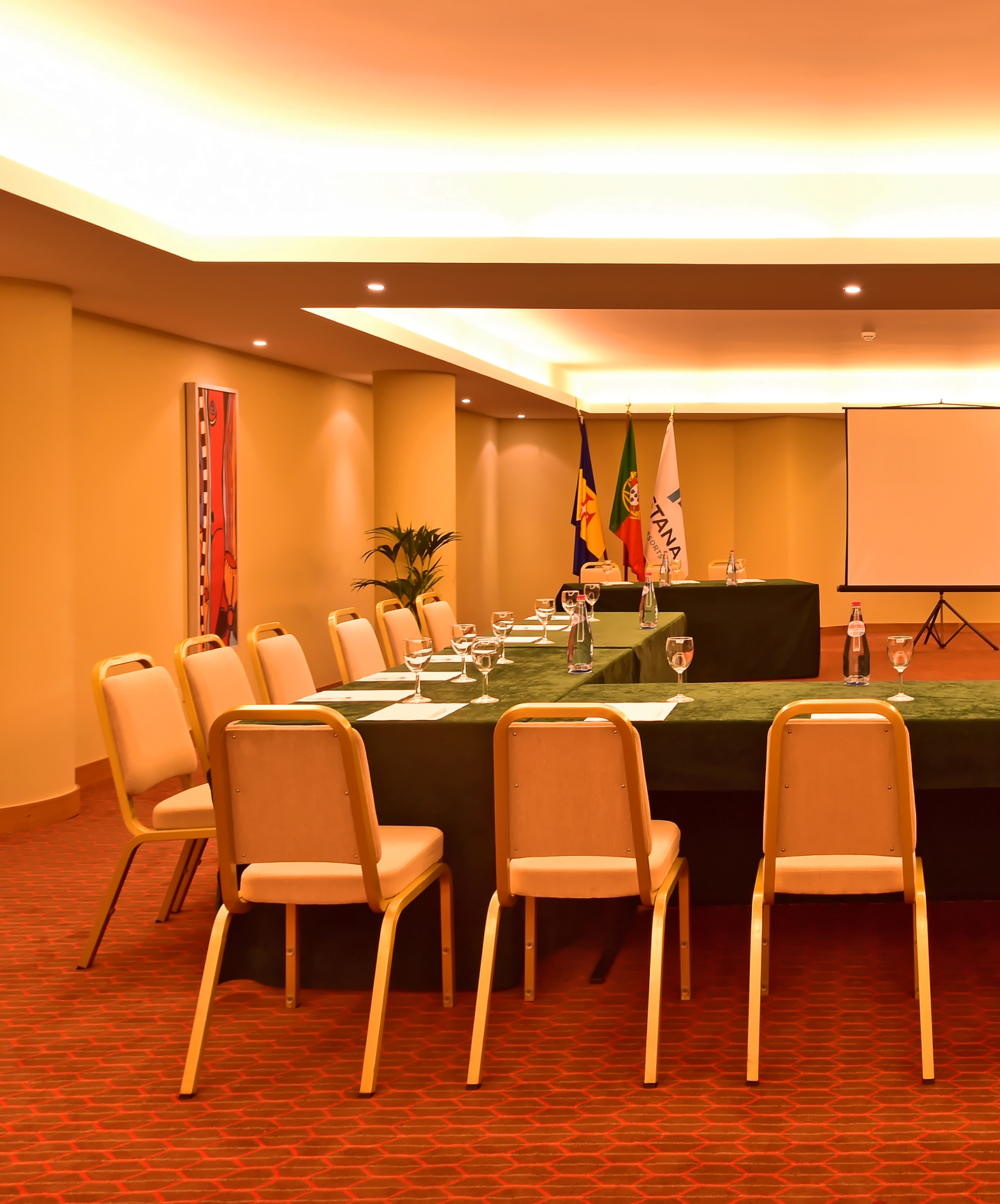 Pestana Promenade a hotel in Madeira near the beach and Lido has a meeting room with chairs and a screen