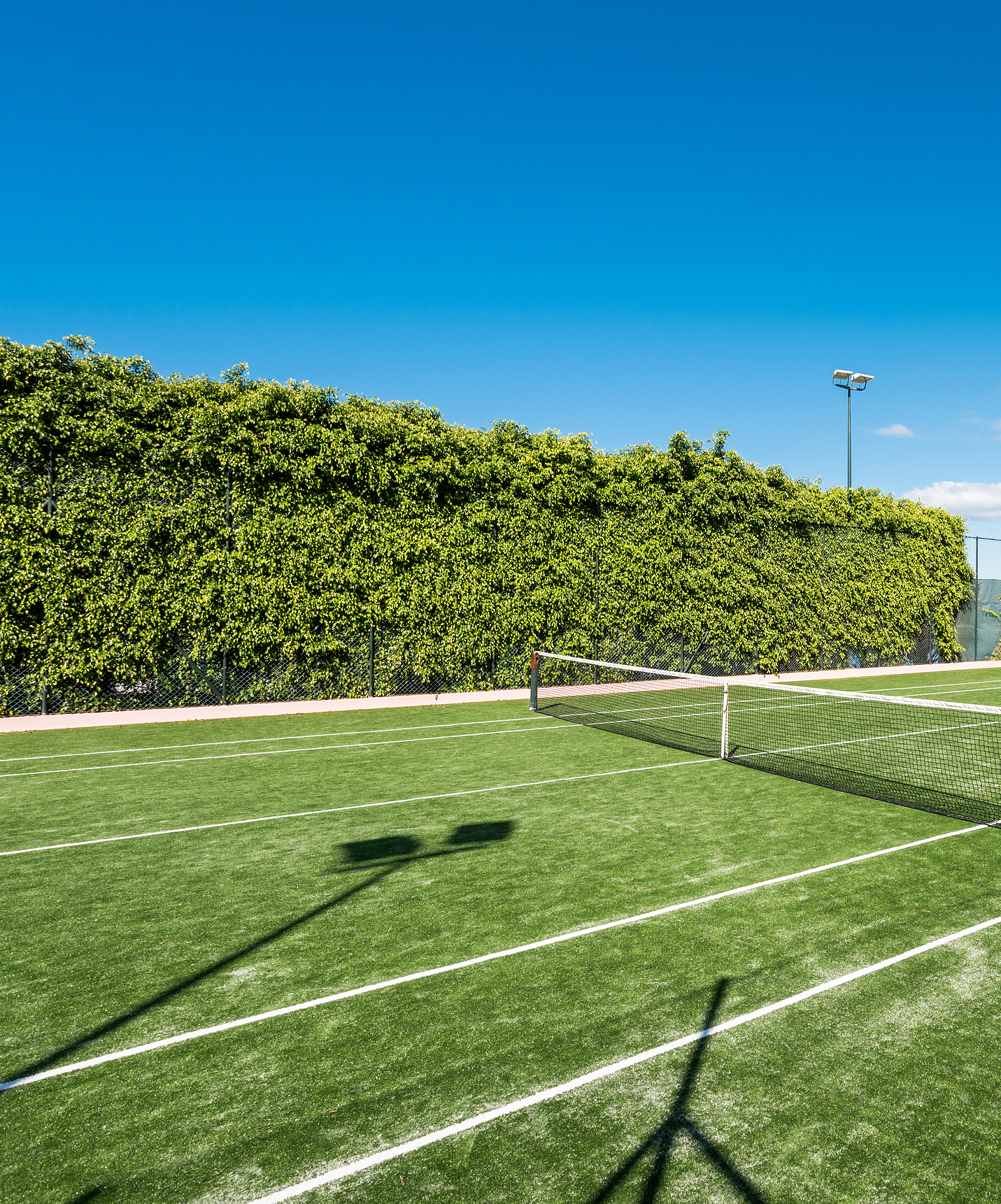 Pestana Royal All Inclusive hotel near the beach features a green tennis court