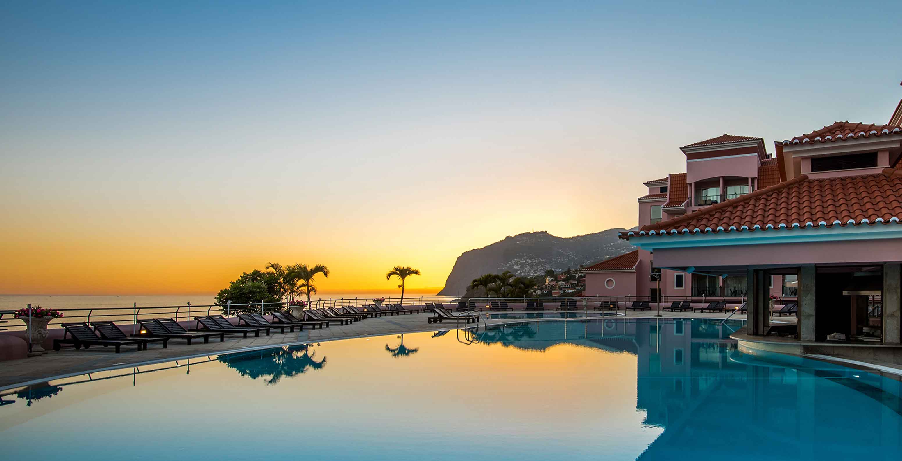 Sunset at the pool of Pestana Royal All Inclusive, a beachfront hotel with all-inclusive services