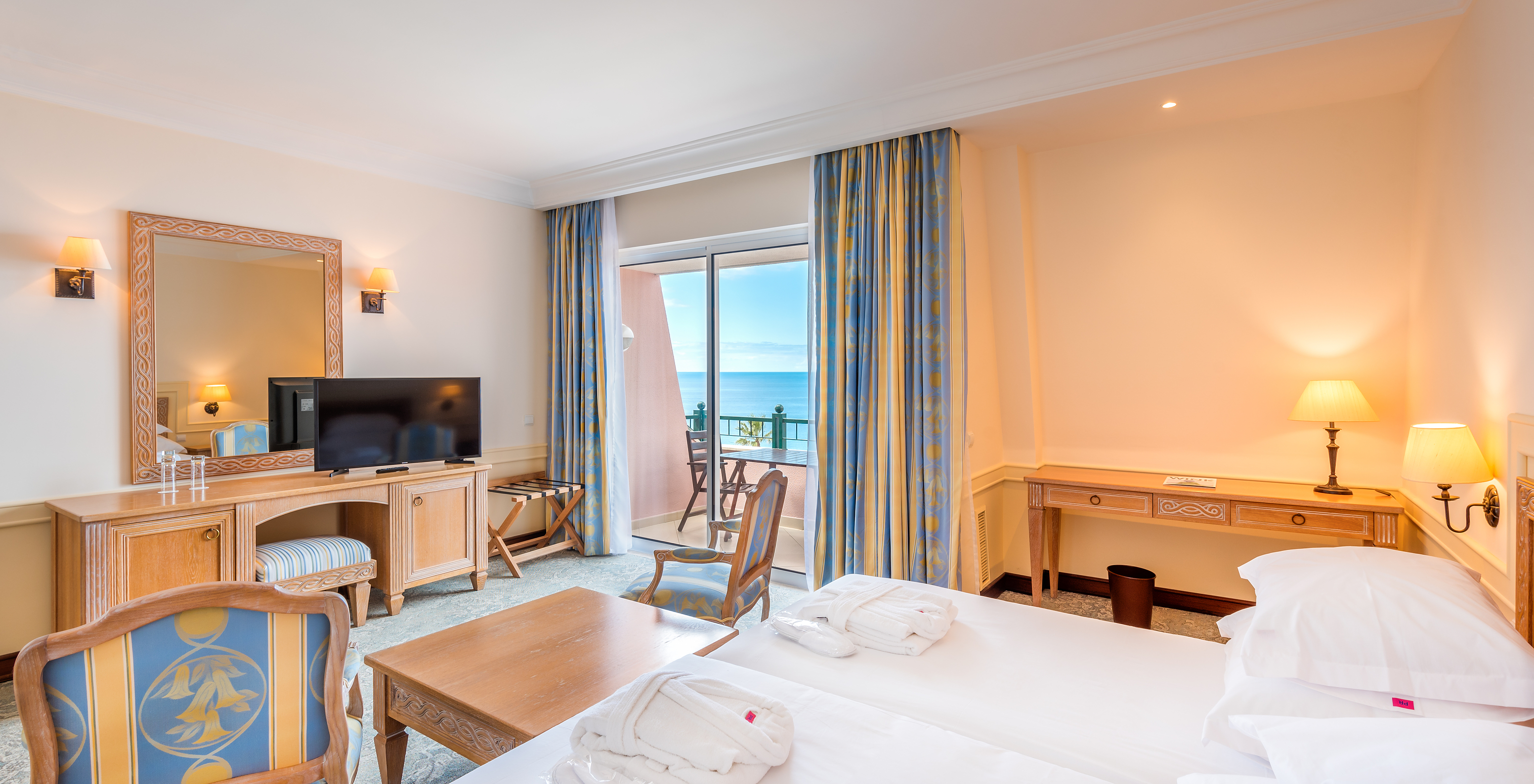 The Superior Deluxe Room with Balcony of Pestana Royal All Inclusive has television, table, and balcony with sea view