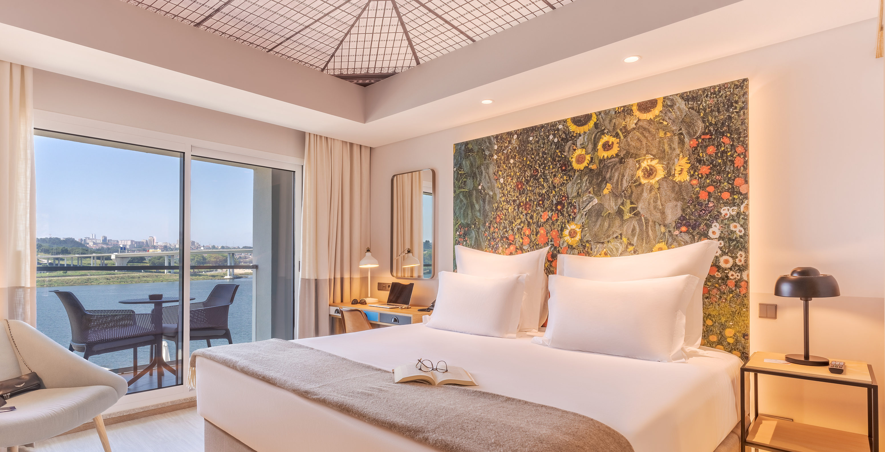 The Grand River View at Pestana Douro Riverside has a double bed, bedside table, and balcony with a view