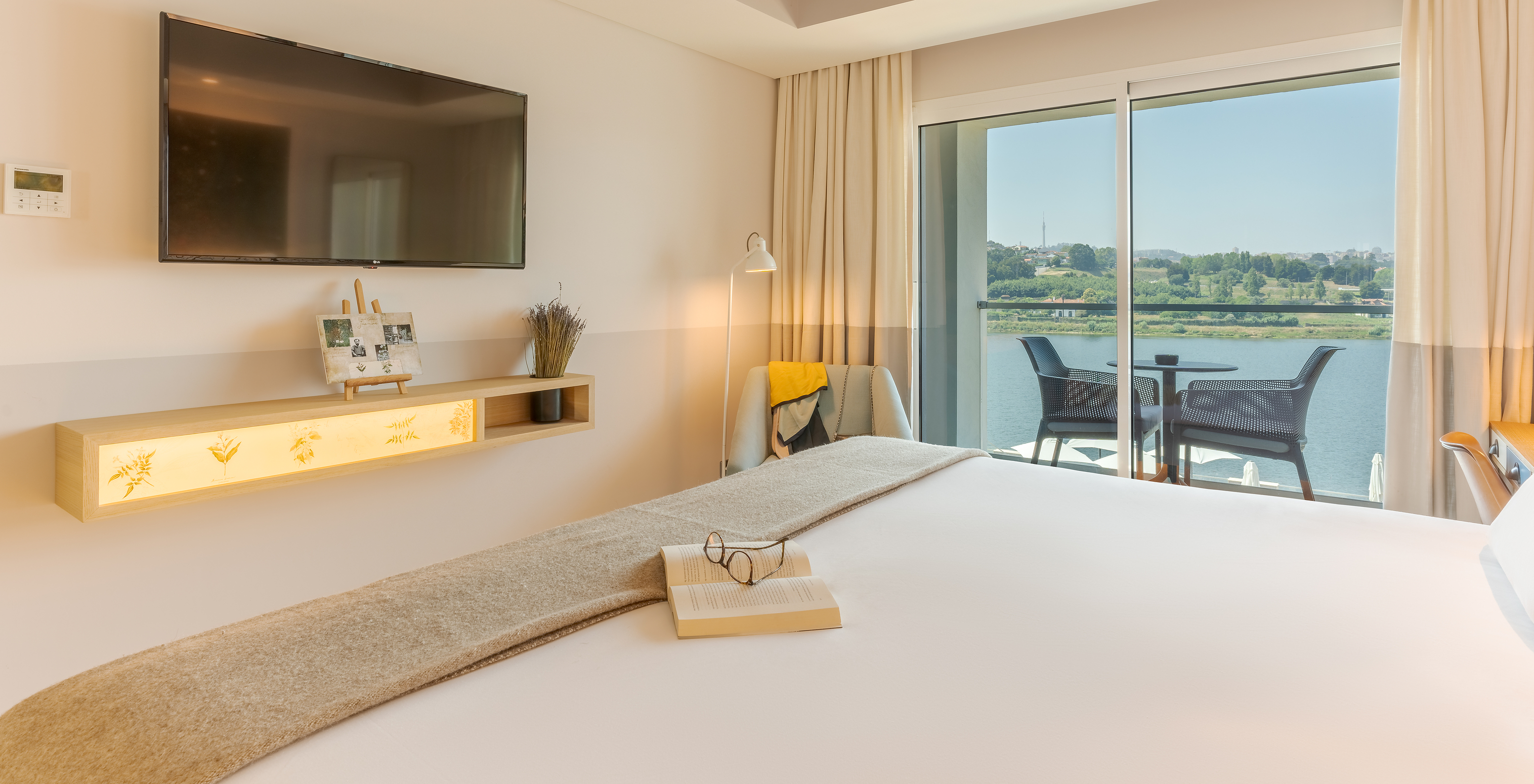 The Grand River View room at Pestana Douro Riverside features a bathroom with a sink, mirror, and shower