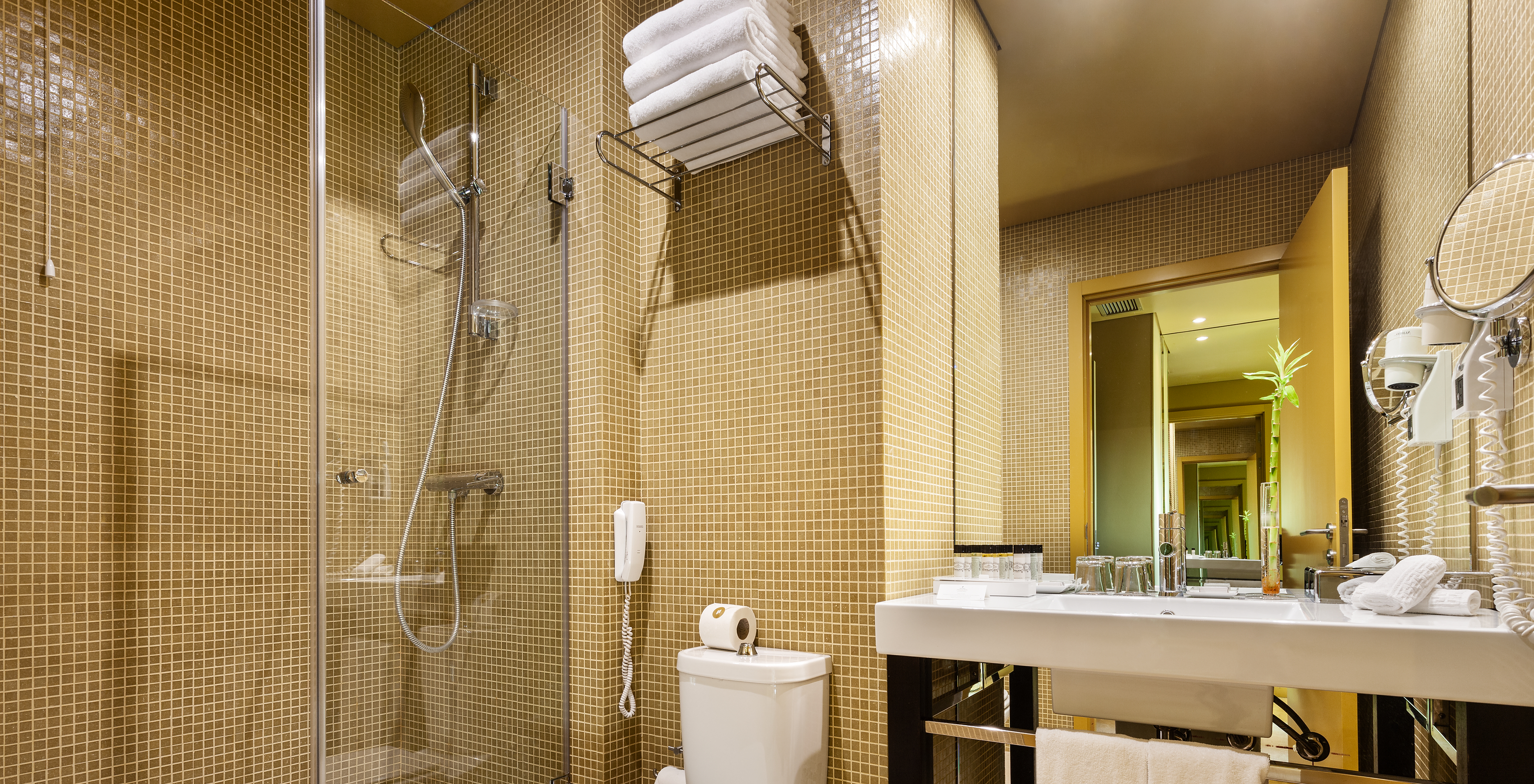 The Classic Attic of Pestana Palácio do Freixo has a bathroom with a shower, toilet, sink, mirror and dryer