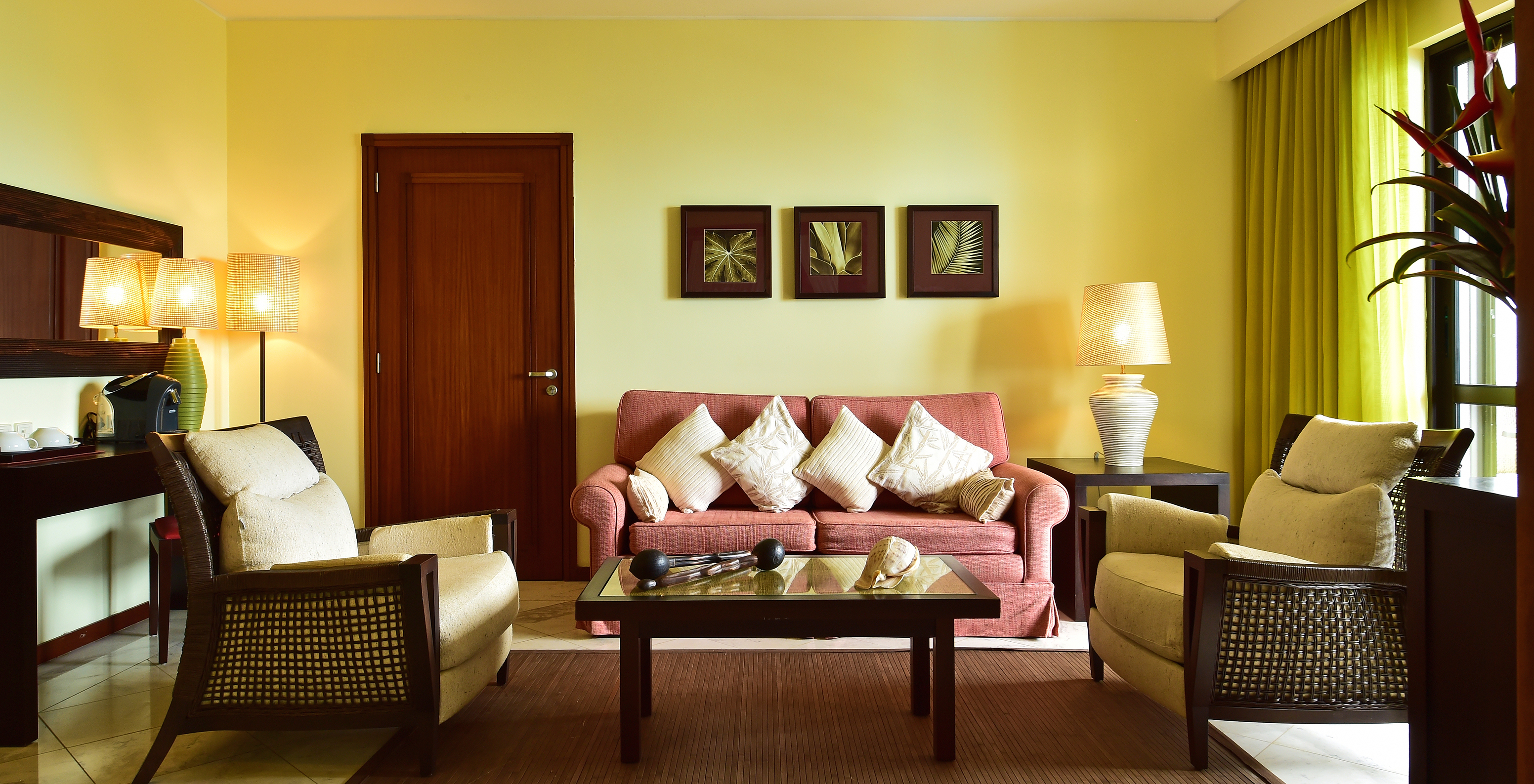 The Central Suite of Pestana São Tomé has a spacious, bright room with a double sofa and two armchairs