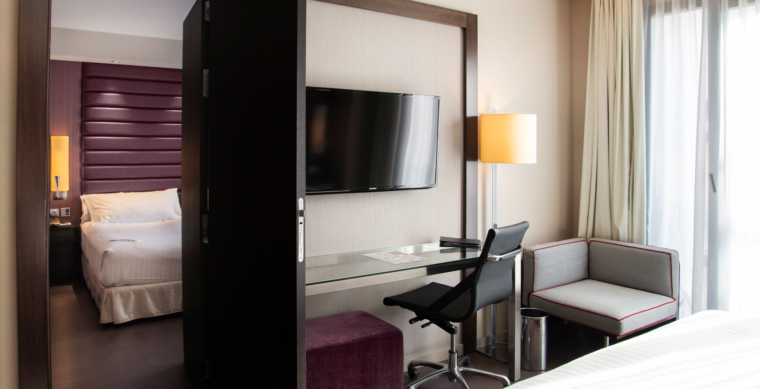 Large Family Room at Pestana Arena Barcelona has two rooms with connecting doors, and two double beds in each room