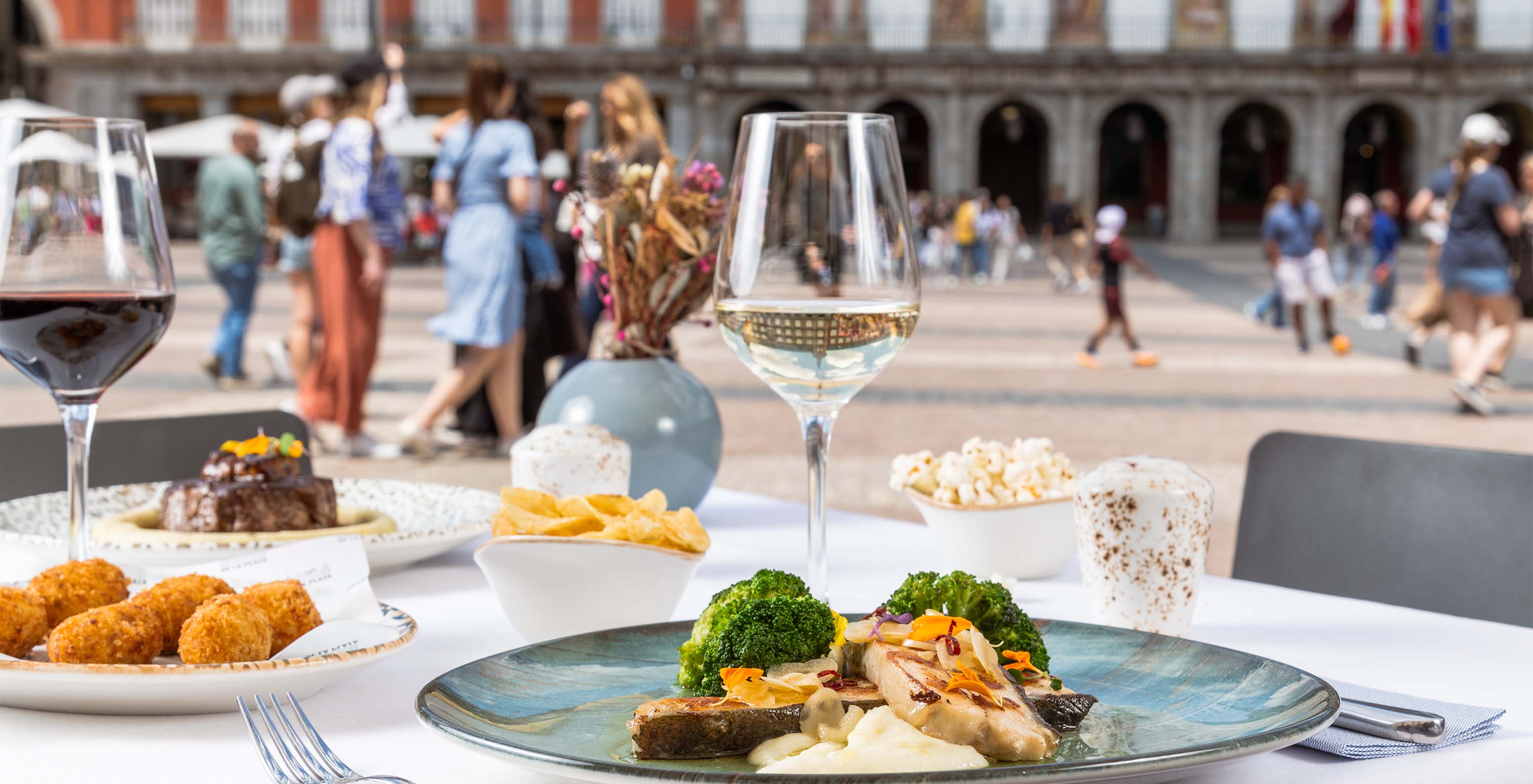 The Café de La Plaza restaurant at the Historic Center Hotel in Madrid serves meals on the terrace in Plaza Mayor