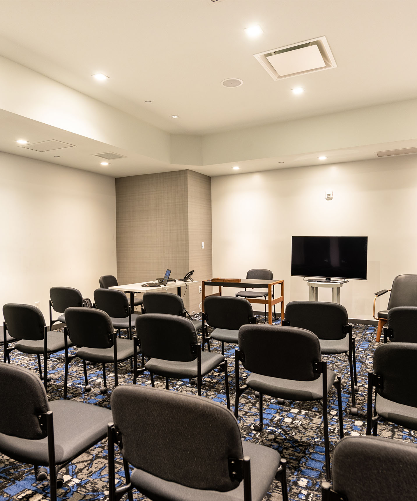 Pestana CR7 Times Square hotel in downtown Manhattan has a meeting room with chairs and a TV