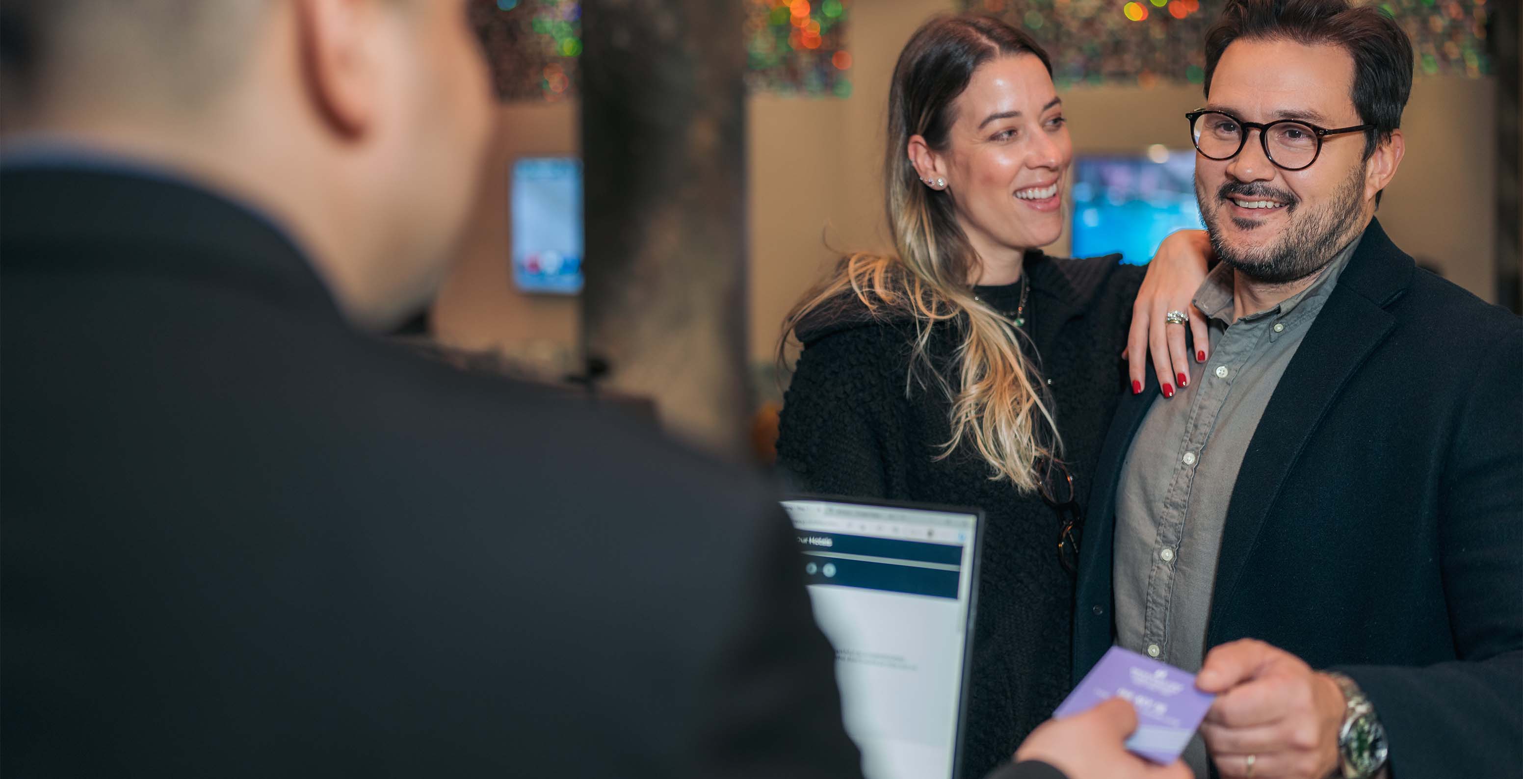 Pestana CR7 Times Square, a hotel in Manhattan, has a reception with a staff member ready to assist guests