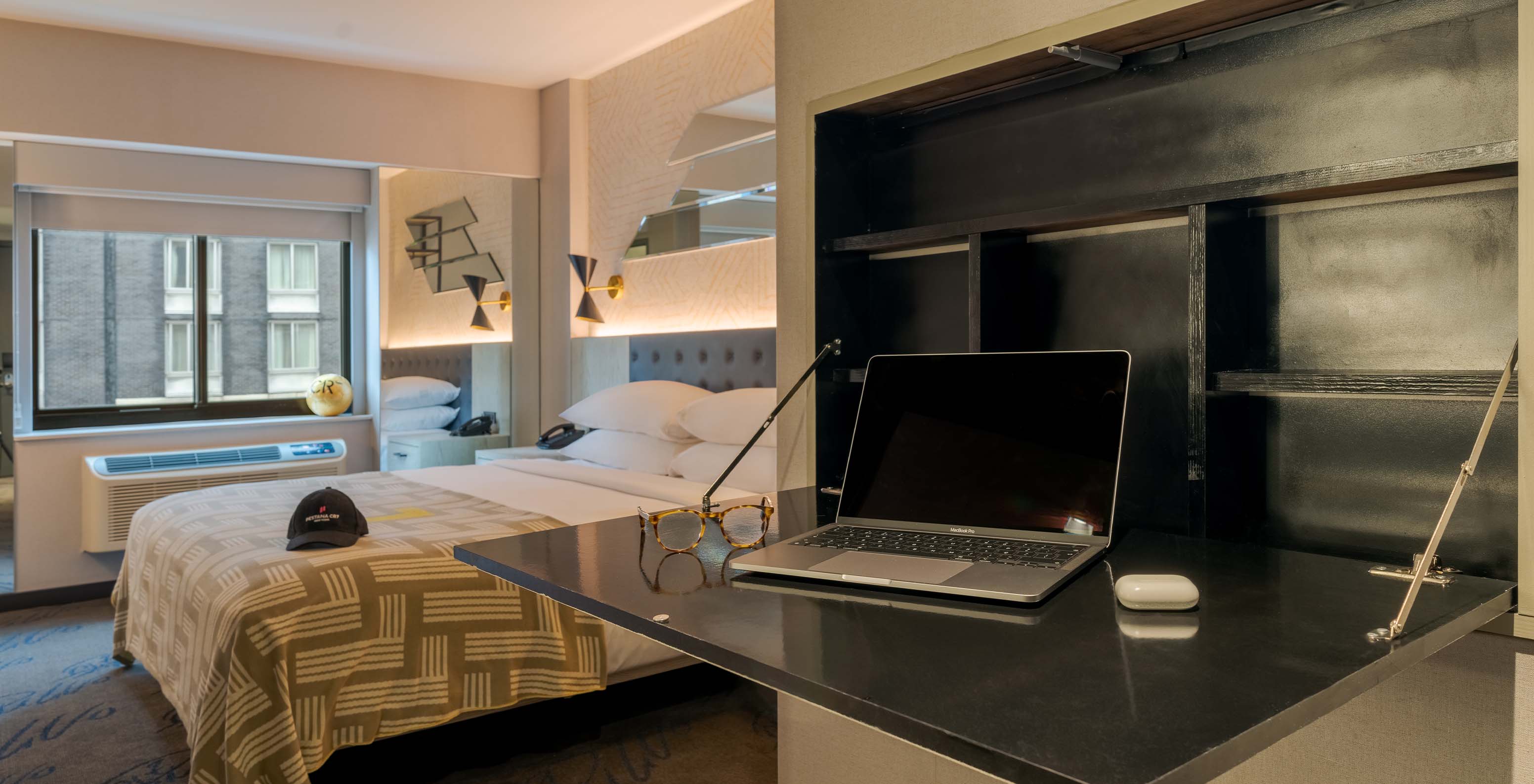 The Superior King High Floor ADA at Pestana CR7 Times Square has a double bed, desk, and TV